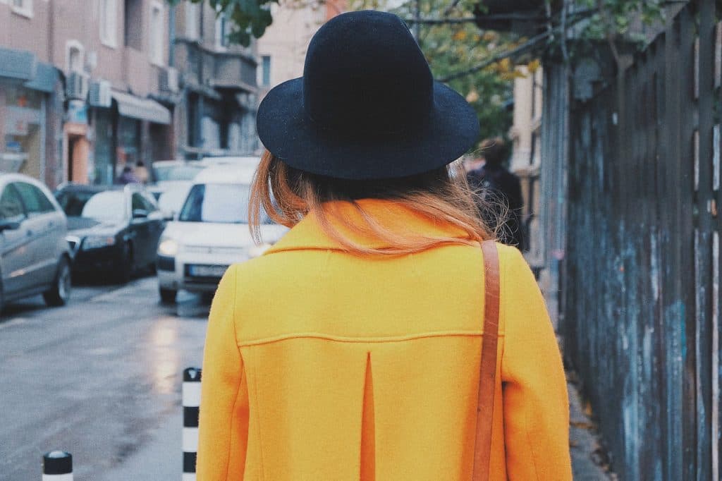 Caitlin Craig Lawrence in a bold yellow coat, a signature look from her fashion blog